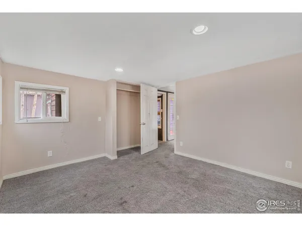 a view of an empty room and window