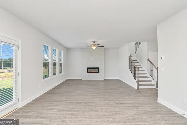 a view of an entryway with wooden floor