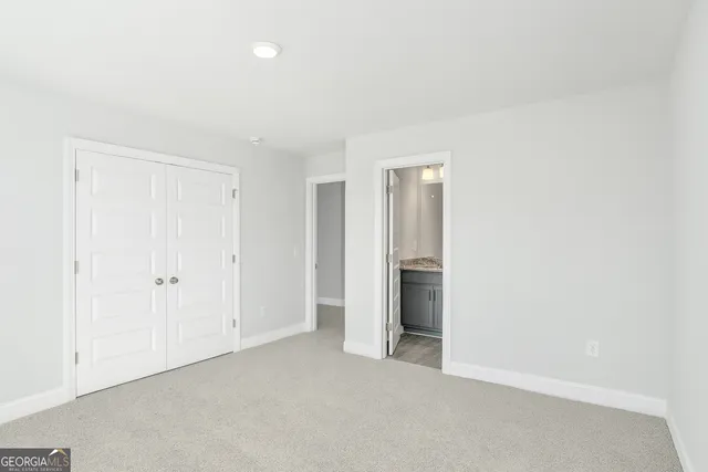 a view of an empty room and a window