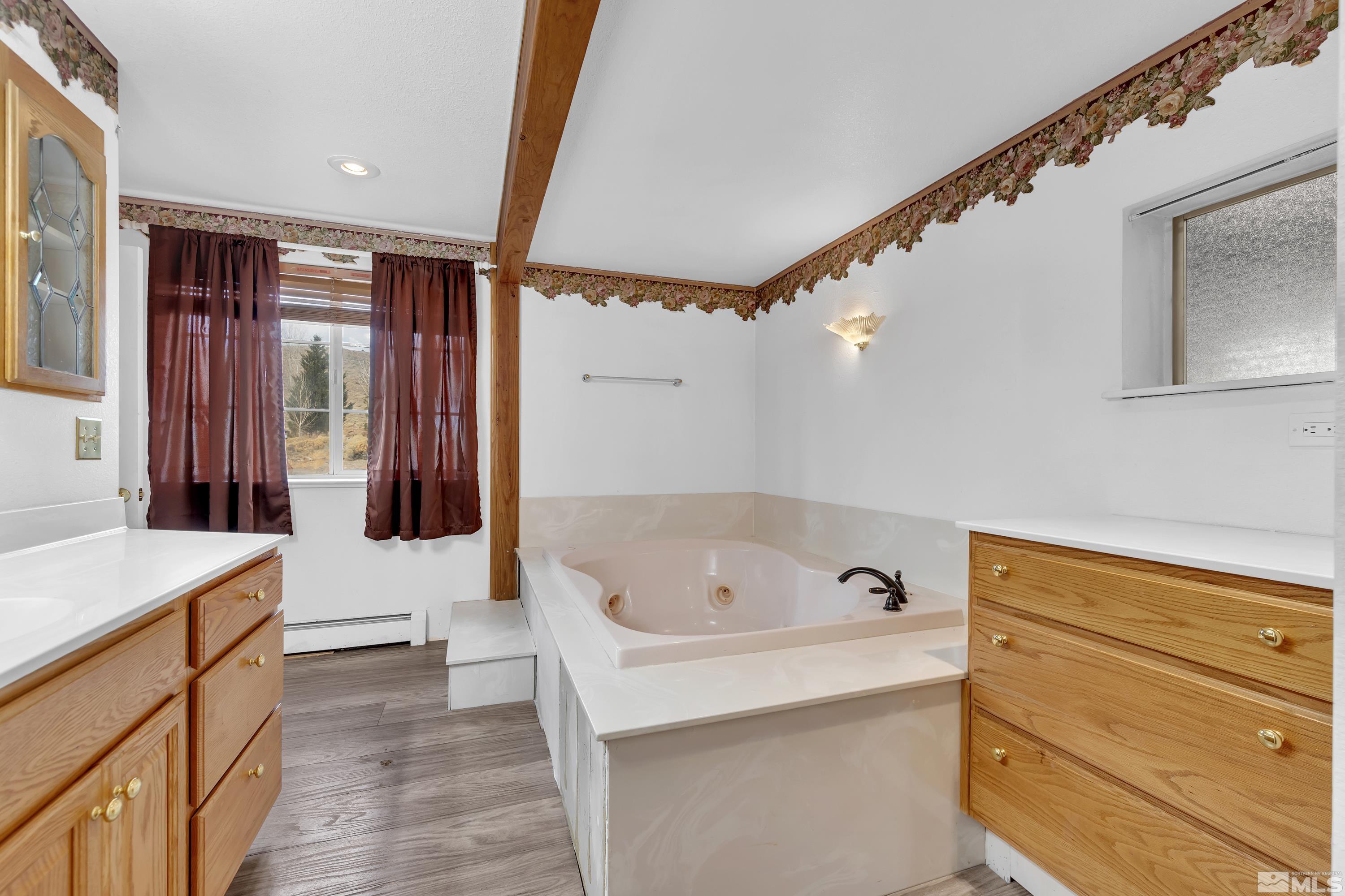 333 Territory Road Dayton, NV 89403 - Photo 21 of 38 a bathroom with a tub sink and mirror