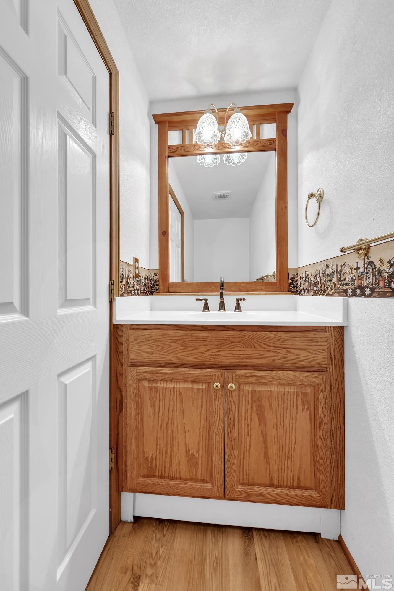 333 Territory Road Dayton, NV 89403 - Photo 25 of 38 a bathroom with a sink and a mirror