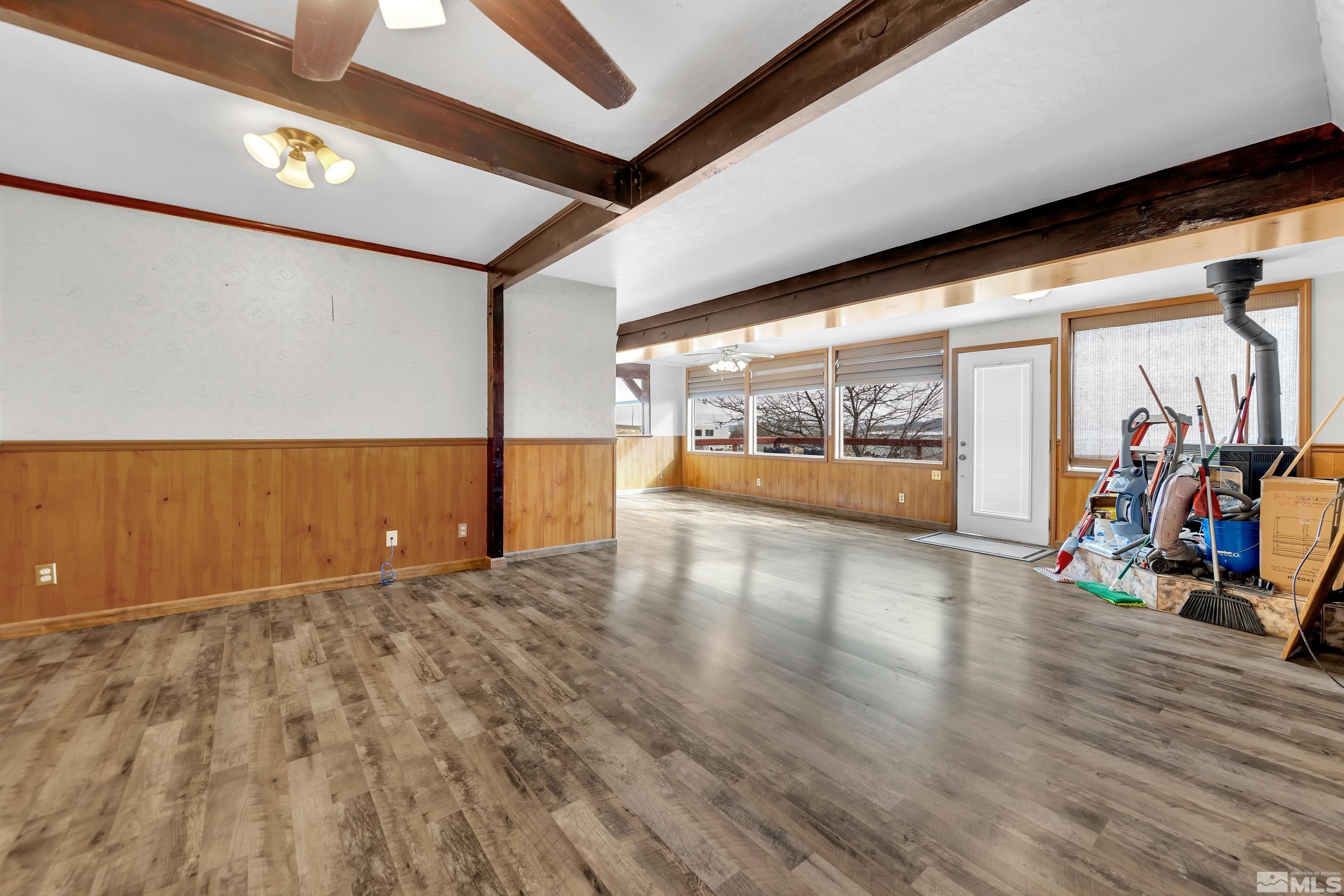 333 Territory Road Dayton, NV 89403 - Photo 3 of 38 an empty room with wooden floor and windows