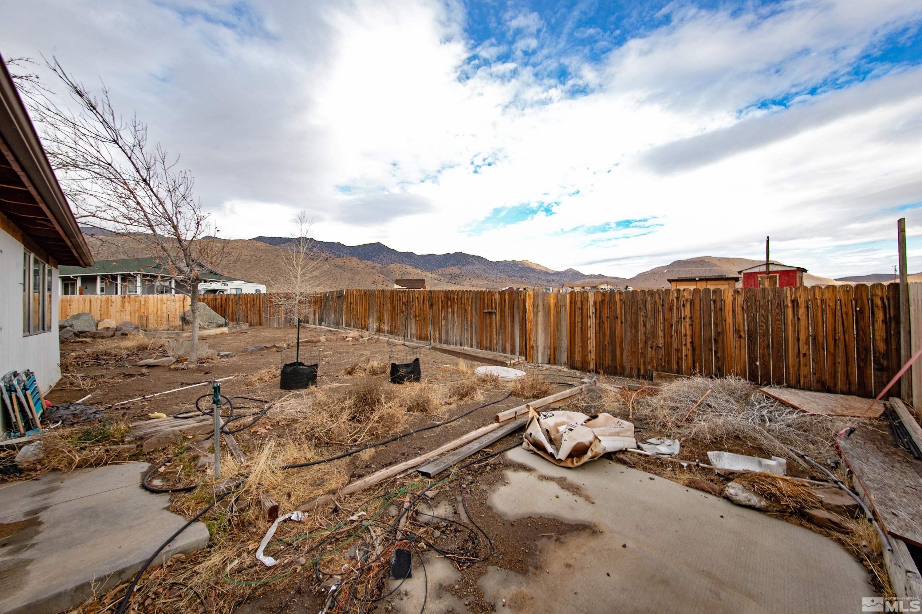 333 Territory Road Dayton, NV 89403 - Photo 36 of 38 a backyard of a house with table and chairs