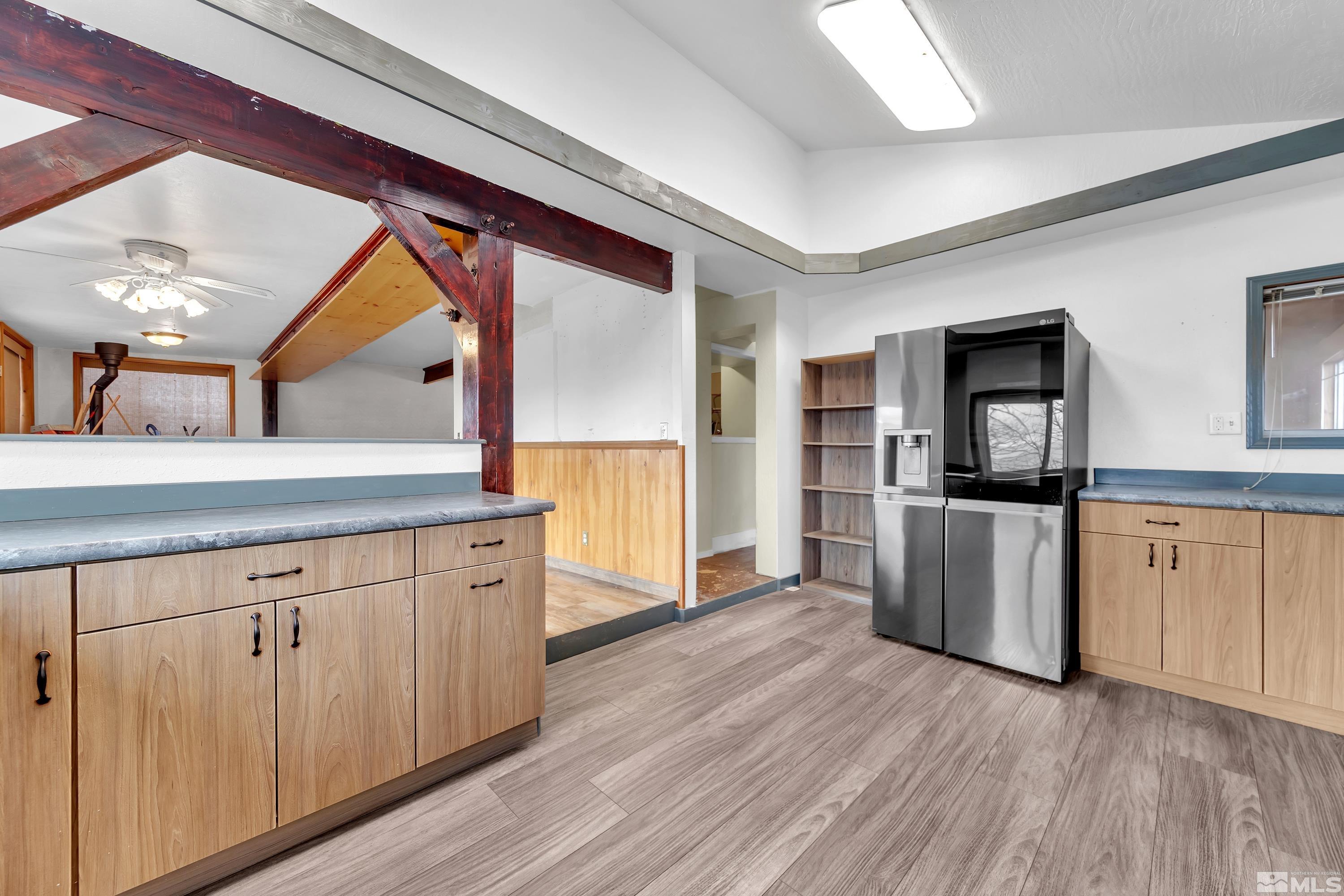 333 Territory Road Dayton, NV 89403 - Photo 9 of 38 a open kitchen with white cabinets and stainless steel appliances