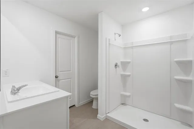 a bathroom with a sink toilet and a bathtub
