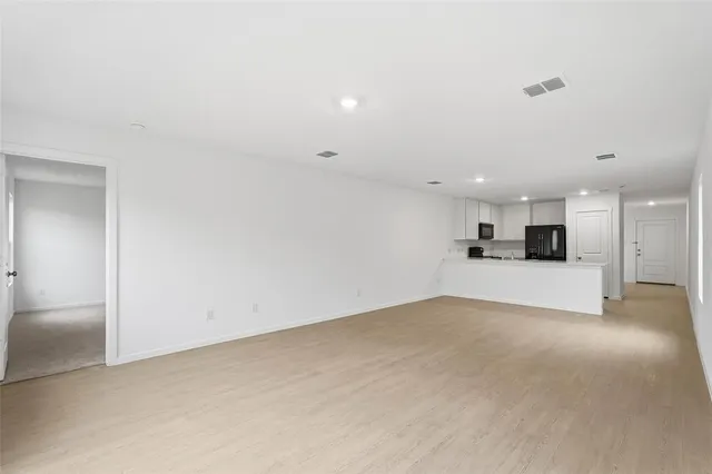 a view of kitchen and kitchen with sink