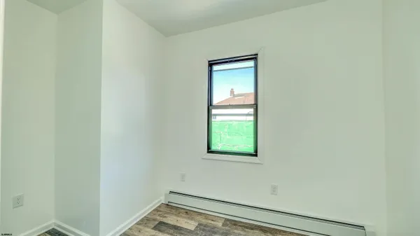 a view of an empty room and window