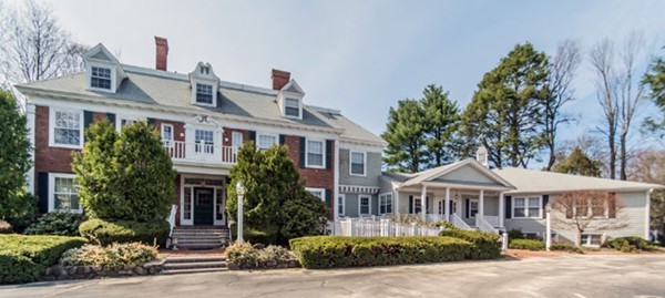 5 Porter Road, Unit 103 Andover, MA 01810 - Photo 1 of 18 a front view of a house with a garden