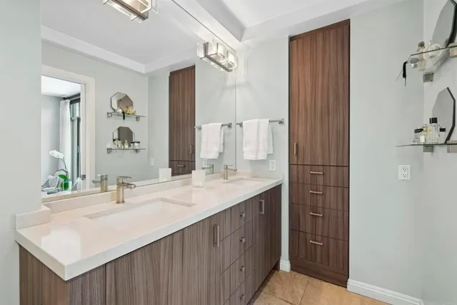 a bathroom with a sink and a mirror