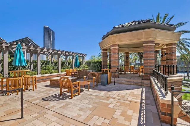 a front view of a building with a yard