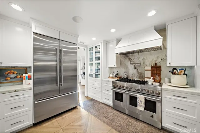 a kitchen with a stove and a sink