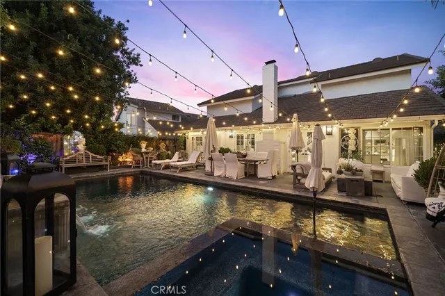 a view of a swimming pool with a patio
