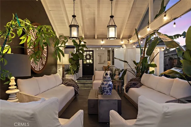 a view of a patio with table and chairs and potted plants