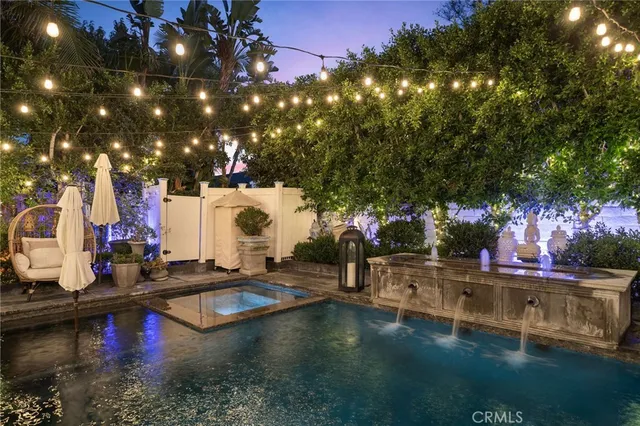a swimming pool view with a sitting space