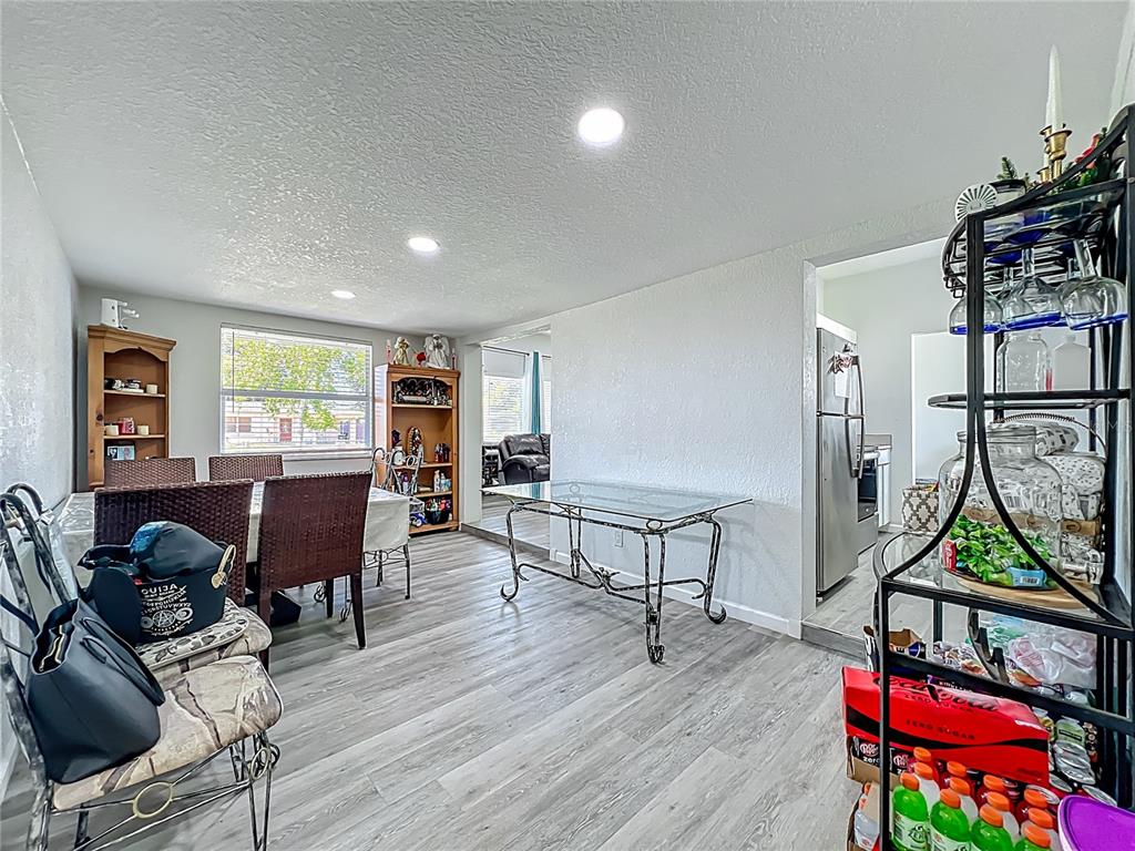 7033 Lakner Way Orlando, FL 32822 - Photo 13 of 31 a living room with furniture a piano and a window