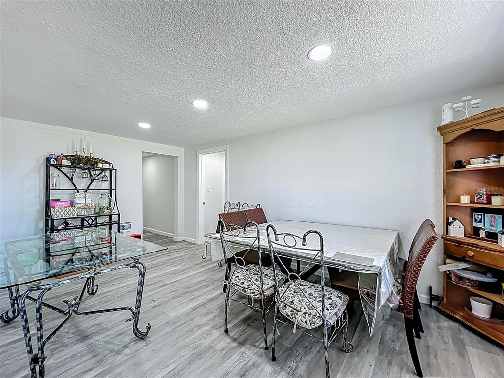 7033 Lakner Way Orlando, FL 32822 - Photo 14 of 31 a reading room with furniture and wooden floor