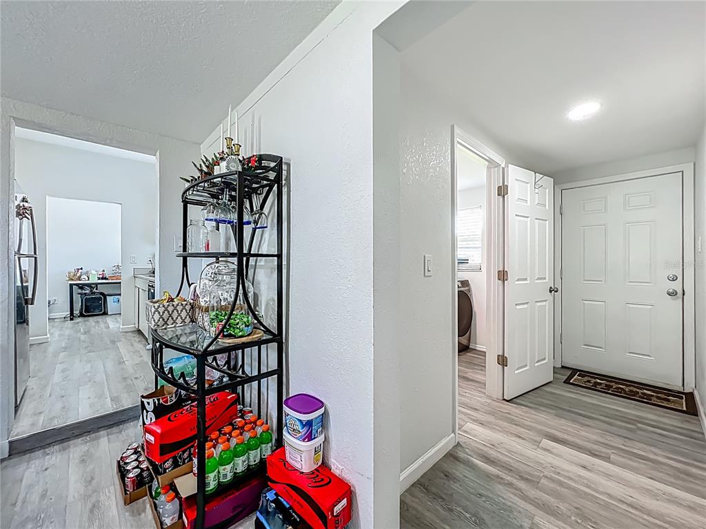 7033 Lakner Way Orlando, FL 32822 - Photo 15 of 31 a view of an entryway with wooden floor