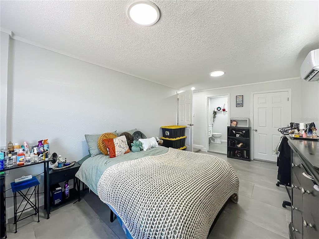 7033 Lakner Way Orlando, FL 32822 - Photo 17 of 31 a bed room with a bed and a chair