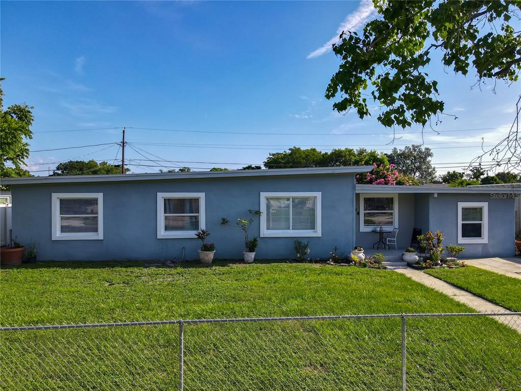 7033 Lakner Way Orlando, FL 32822 - Photo 2 of 31 a house view with a garden space