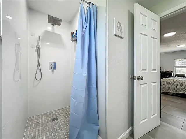 a view of a bathroom from a hallway