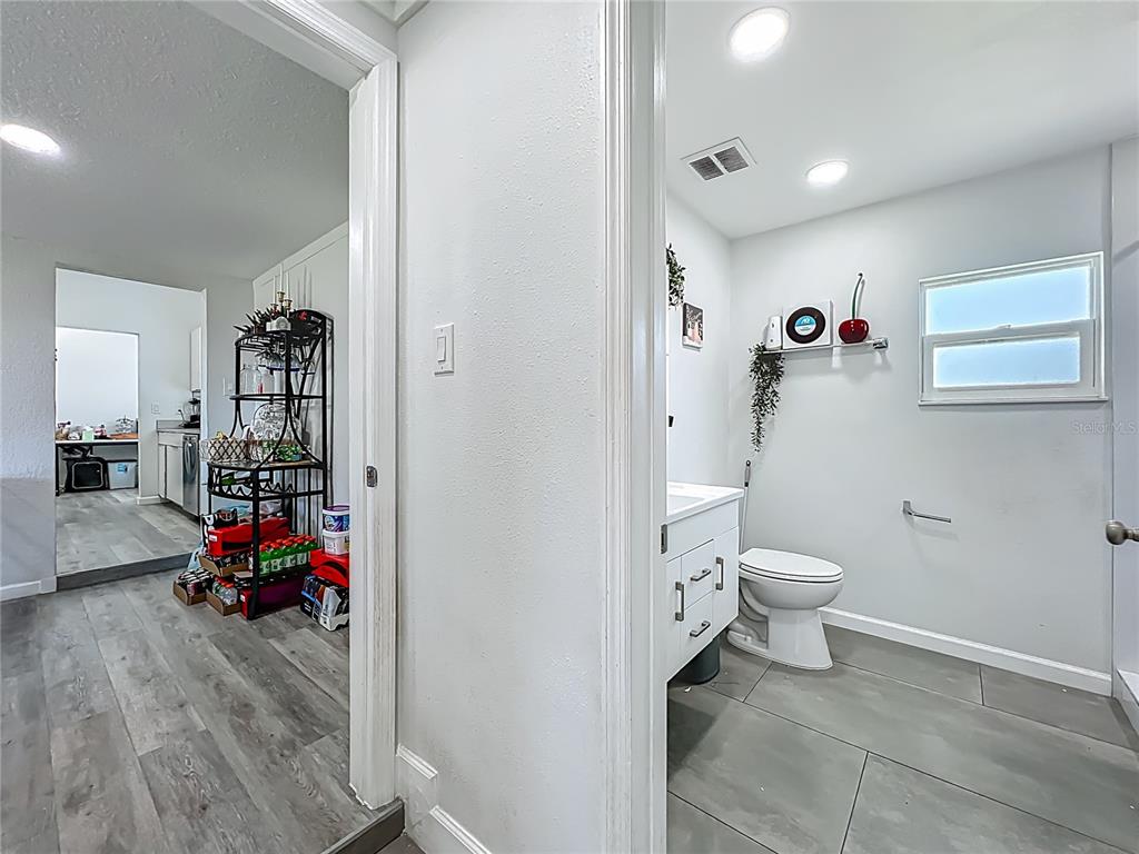 7033 Lakner Way Orlando, FL 32822 - Photo 22 of 31 a bathroom with a toilet and a shower