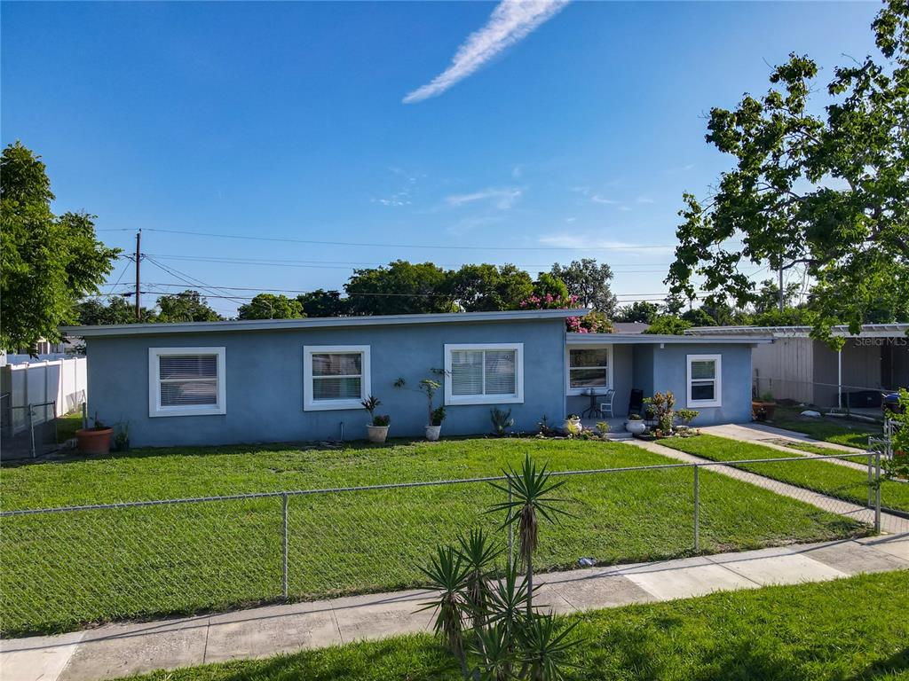 7033 Lakner Way Orlando, FL 32822 - Photo 3 of 31 a view of a house with a yard