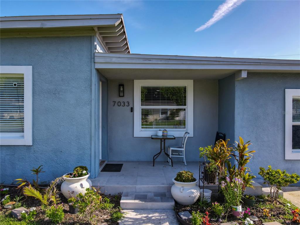 7033 Lakner Way Orlando, FL 32822 - Photo 4 of 31 a front view of a house with seating space