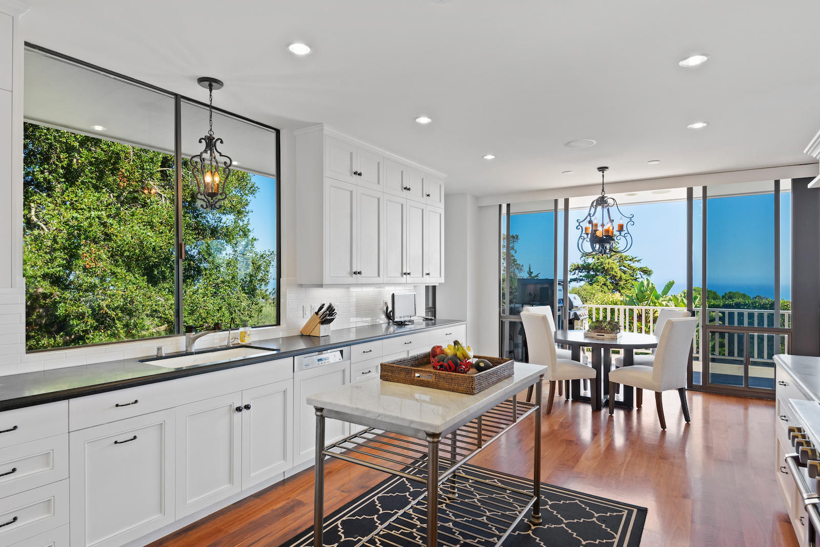 1171 Glenview Road Santa Barbara, CA 93108 - Photo 6 of 19 a kitchen with a table chairs stove and cabinets