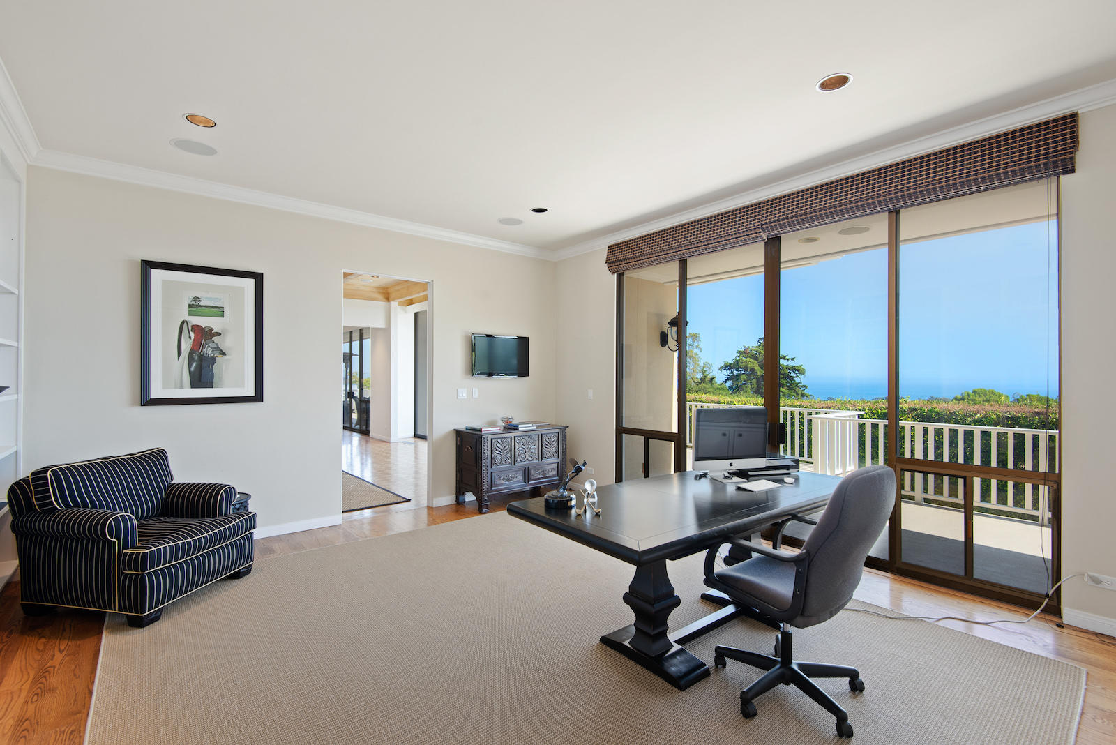 1171 Glenview Road Santa Barbara, CA 93108 - Photo 8 of 19 a living room with furniture floor to ceiling window and a flat screen tv