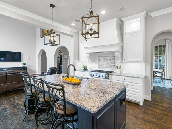 a kitchen with a table and chairs in it
