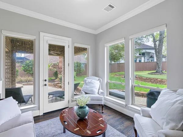 a bathroom with a granite countertop bathtub a sink and a mirror