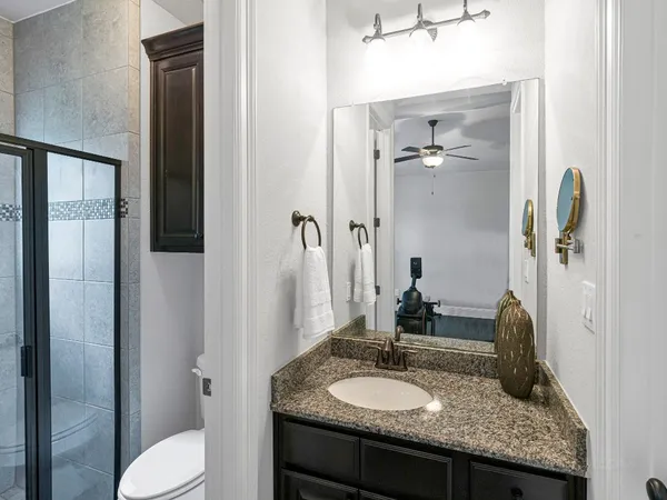 a living room with furniture a flat screen tv and a large window
