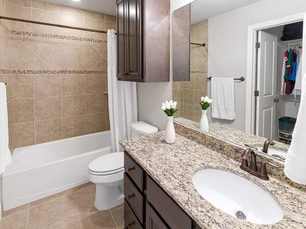 a view of a patio with a dining table and chairs