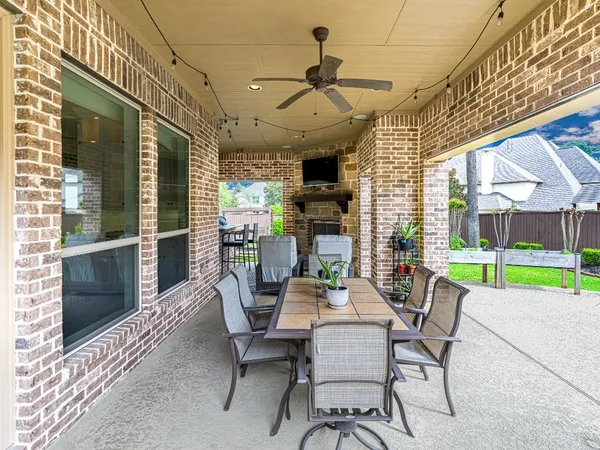 a view of a swimming pool with sitting area