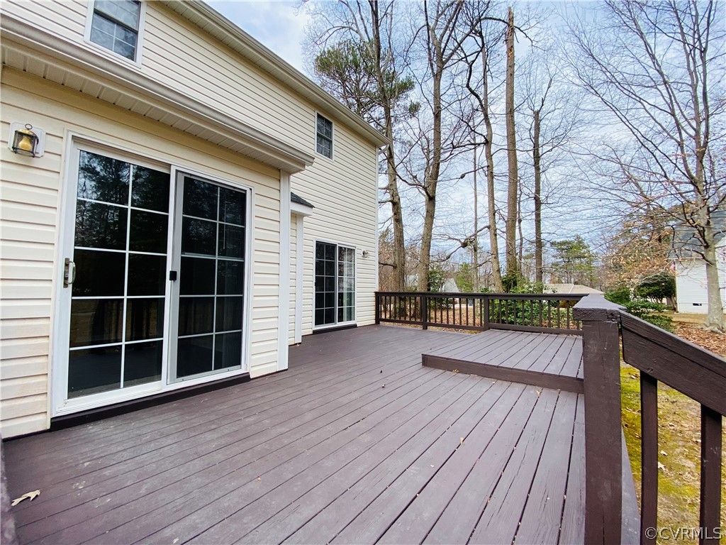 6956 Fox Drive Prince George, VA 23875 - Photo 23 of 26 a view of balcony with wooden floor and floor to ceiling window