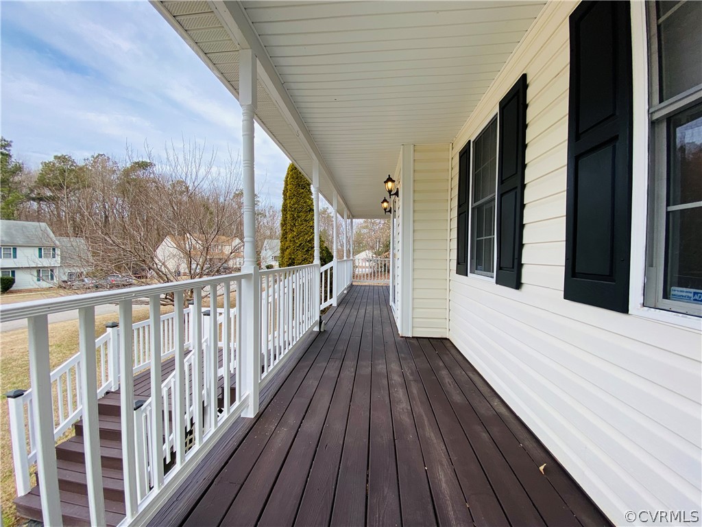 6956 Fox Drive Prince George, VA 23875 - Photo 3 of 26 a view of a balcony with wooden floor