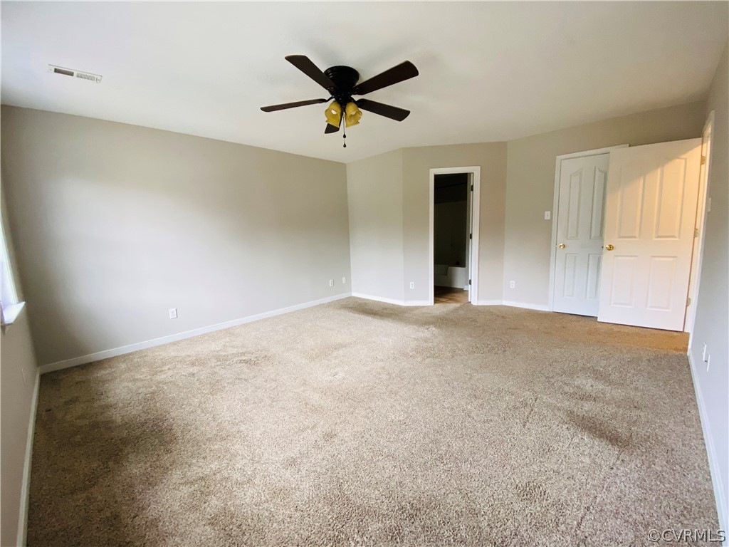 6956 Fox Drive Prince George, VA 23875 - Photo 10 of 26 a view of a livingroom with a ceiling fan and window