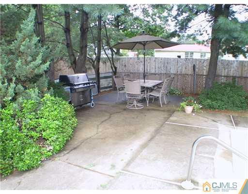 34 Glen Gary Road Middlesex, NJ 08846 - Photo 11 of 14 a view of a backyard with sitting area and furniture
