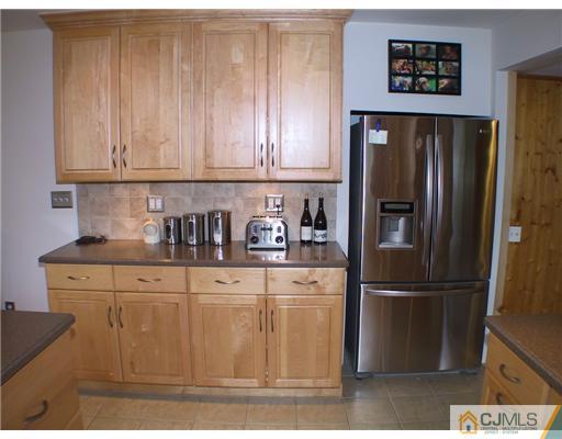 34 Glen Gary Road Middlesex, NJ 08846 - Photo 4 of 14 a kitchen with stainless steel appliances granite countertop a refrigerator and a cabinets