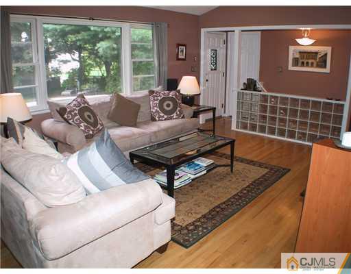 34 Glen Gary Road Middlesex, NJ 08846 - Photo 5 of 14 a living room with furniture and a floor to ceiling window