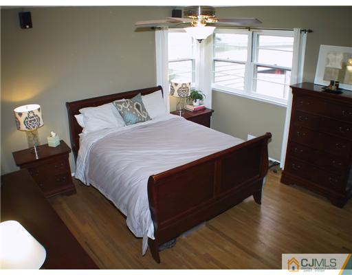 34 Glen Gary Road Middlesex, NJ 08846 - Photo 6 of 14 a bedroom with a bed and wooden floor