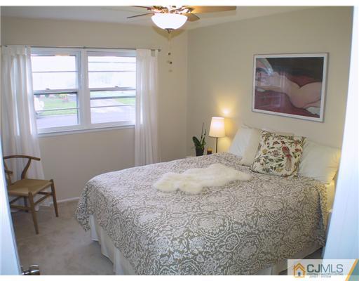 34 Glen Gary Road Middlesex, NJ 08846 - Photo 7 of 14 a bedroom with a bed and a painting on the wall