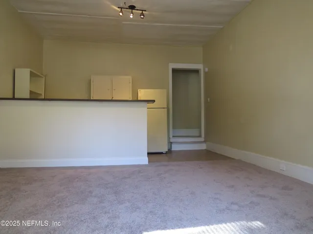 a view of cabinets with washer and dryer