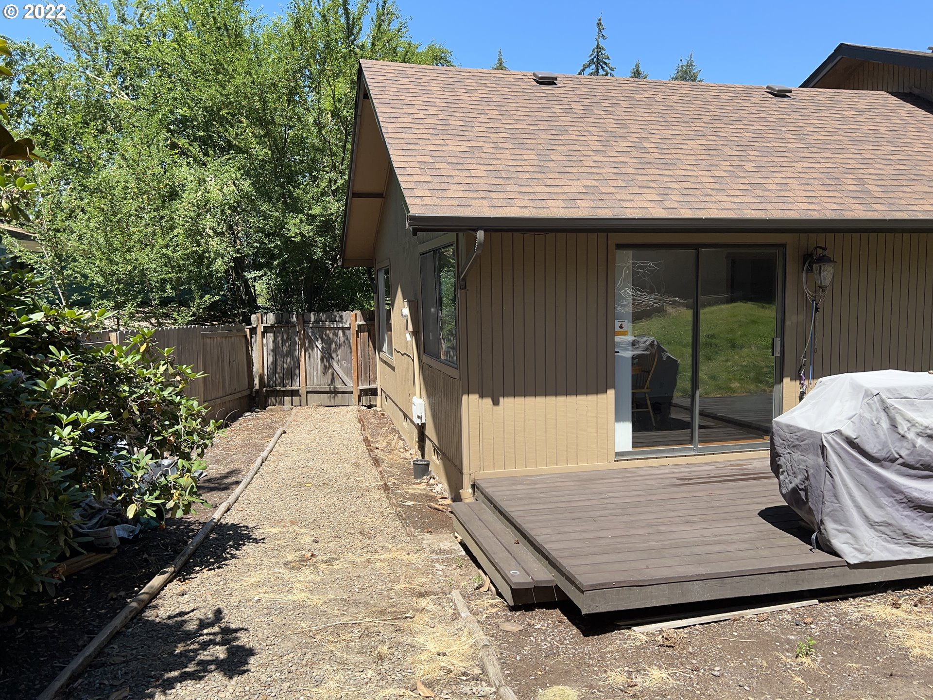 361 South 68th Place Springfield, OR 97478 - Photo 4 of 32 a view of a backyard with a patio