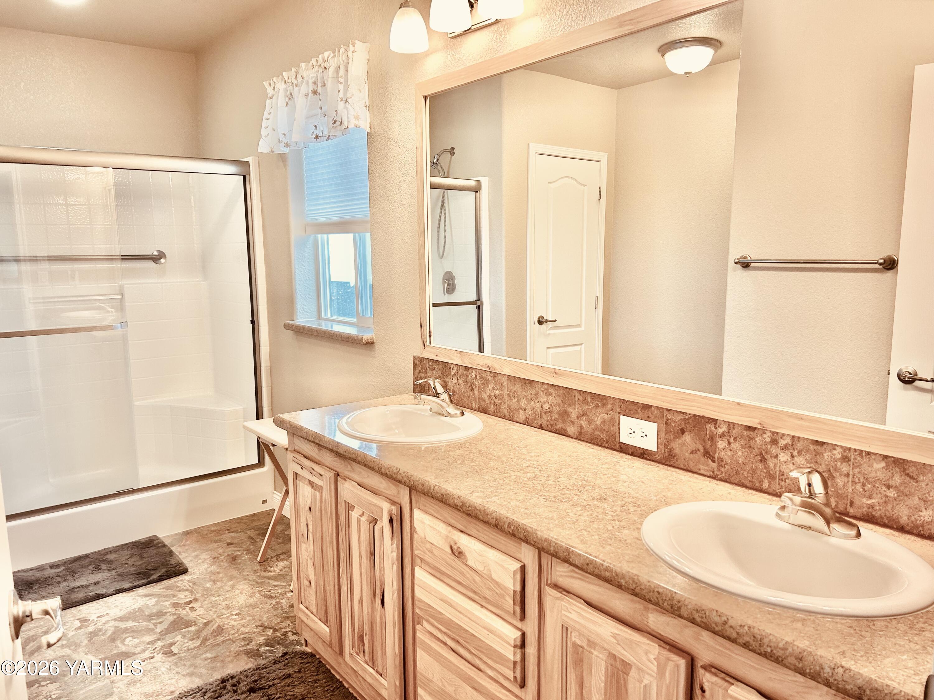 200 Bridle Way, Unit 165 Yakima, WA 98901 - Photo 19 of 21 a bathroom with a granite countertop sink and a mirror