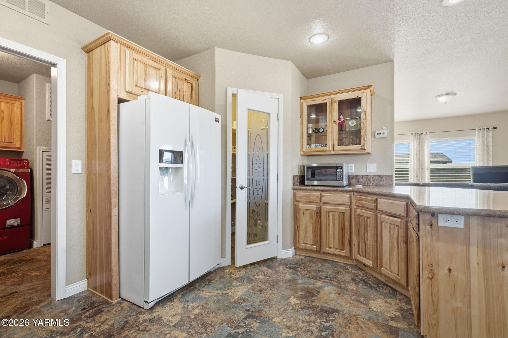 200 Bridle Way, Unit 165 Yakima, WA 98901 - Photo 7 of 21 a kitchen with stainless steel appliances granite countertop a refrigerator and a stove top oven