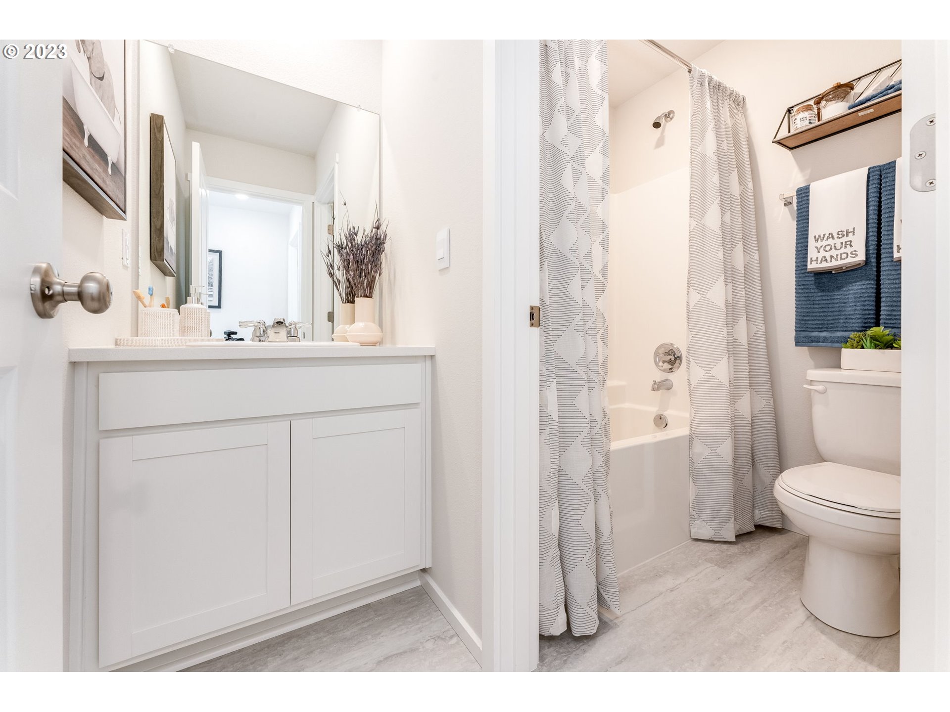 17413 Northwest 10th Avenue Ridgefield, WA 98642 - Photo 19 of 27 a bathroom with a sink toilet and shower