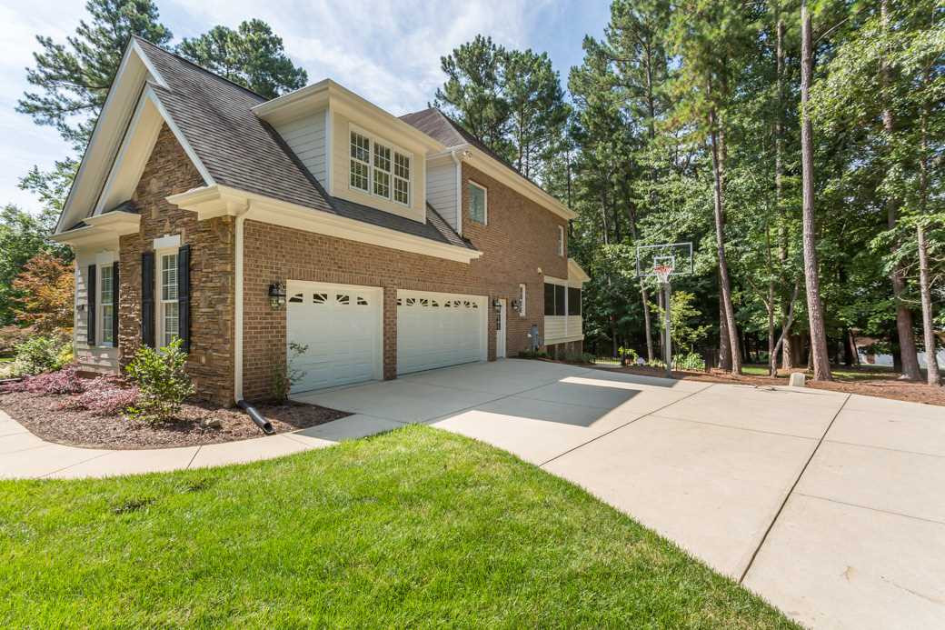 7220 Sunset Glen Point Raleigh, NC 27614 - Photo 25 of 25 3-car garage and long driveway can accommodate many guests. Exterior Back