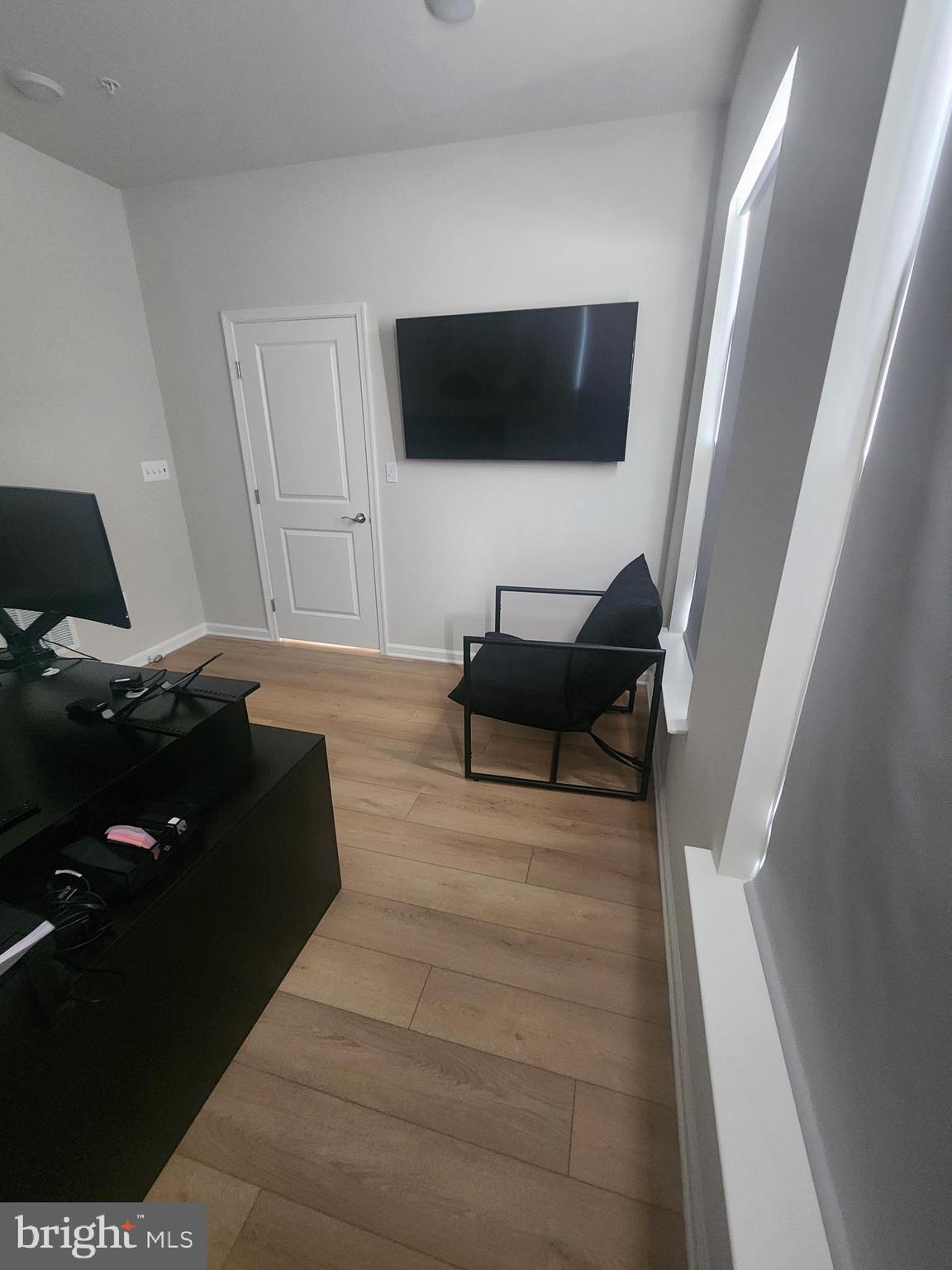 234 Mainstream Drive Laurel, MD 20724 - Photo 13 of 40 a living room with furniture and a flat screen tv