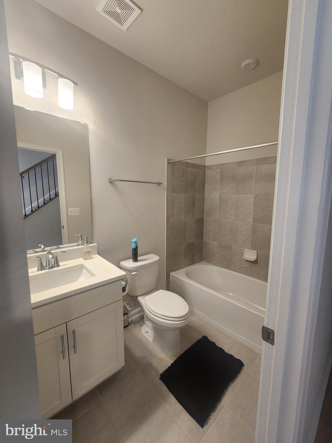 234 Mainstream Drive Laurel, MD 20724 - Photo 14 of 40 a bathroom with a sink a toilet and shower